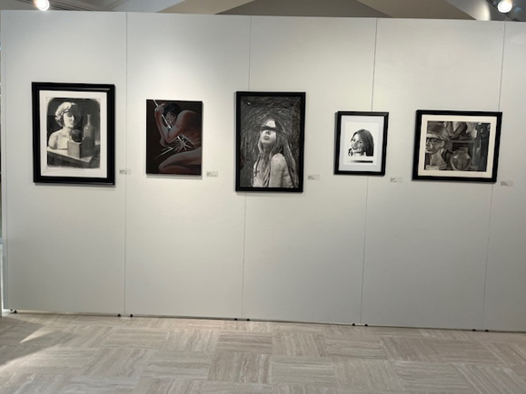 inside of front wall of the student show with various works of art